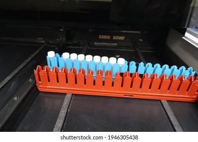 Radioactive samples in plastic capped vials, loaded to be read by a liquid scintillation counter                               
