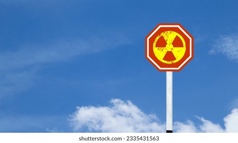 The radioactive symbol on red warning sign with blue sky background concept of beware of radioactive materials                                - Powered by Shutterstock