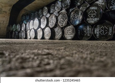 Radioactive waste package barrels in underground repository, terrorism pollution apocalypse concept - Shutterstock ID 1235245465