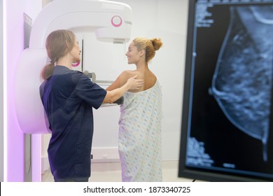 Radiographer guiding a Patient at the mammogram system
