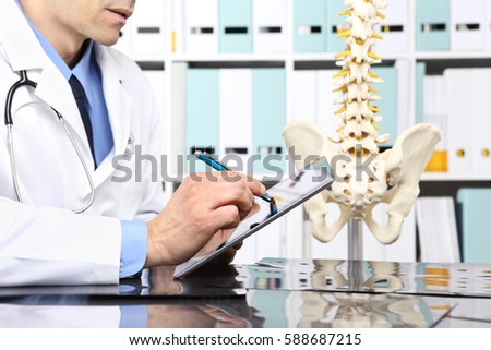 Radiologist doctor with digital tablet checking x ray, health care, medical and radiology concept