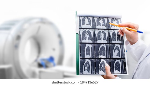 Radiologist Showing Tomography Scan Of A Patient's Lungs Over Of CT Machine. Treatment Of Lung Diseases, Pneumonia, Coronavirus, Covid, Cancer, Tuberculosis