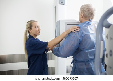 Radiologist Taking Xray Of Mature Man In Hospital