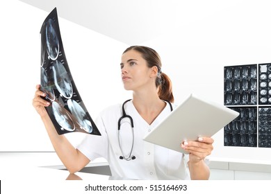 Radiologist Woman Checking X Ray, With Tablet, Medical And Radiology Concept