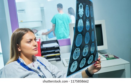 Radiologist woman checking x-ray, health care, medical and radiology concept - Shutterstock ID 1175858662