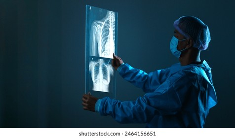 radiology doctor examining at chest x ray film of patient at hospital room. - Powered by Shutterstock