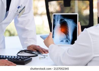 Radiology And Medicine Concept. Doctor Explaining The Results Of Scan Lung On Digital Tablet Screen To Patient With Long Covid