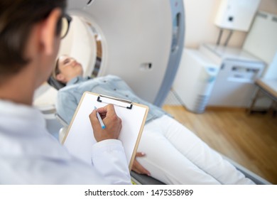 Radiology Technologist Holding Clipboard And Pen Stock Photo