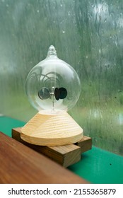 Radiometer On A Window Sill On A Rainy Day