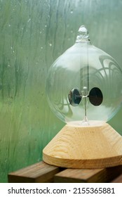 Radiometer On A Window Sill On A Rainy Day