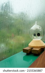 Radiometer On A Window Sill On A Rainy Day