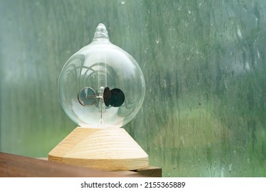 Radiometer On A Window Sill On A Rainy Day