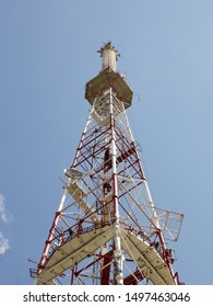 Radio-television Tower For Receiving And Transmitting Electromagnetic Signals At A Distance. Metal High-tech Construction Shrouded In A White Cloud. The Source Of The Pulse Frequency. Lviv, Ukraine.