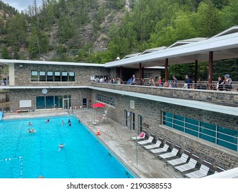 Radium Hot Springs, Alberta, Canada - July 7, 2022: People Wait In Line To Get Into Radium Hot Springs Public Swimming Pools With Naturally Thermal Water On A Busy Summer Day