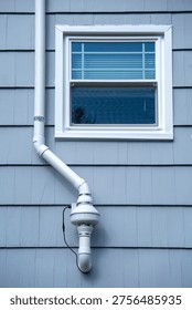 radon mitigation installed system outside the house