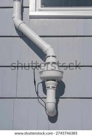 radon mitigation installed system outside the house