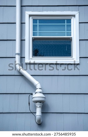 radon mitigation installed system outside the house