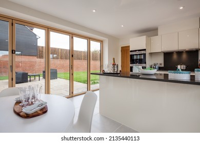 Radwinter, Essex - Sept 12 1018: Modern Furnished Open Plan Kitchen Dining Room Within Brand New House With Bifold Doors To Garden And Patio