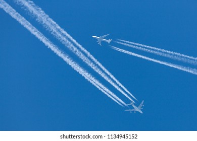 RAF Fairford, Gloucestershire, UK - July 10, 2014: Singapore Airlines Airbus A380 Flying At Cruising Altitude With A Lufthansa Boeing 747 Flying In Close Proximity. 