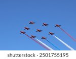 RAF Red Arrows flying over Blackpool Airport following their display at Blackpool Airshow, Saturday 10th of August 2024.