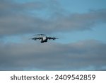 RAF Royal Air Force Airbus C.1 A400M Atlas military cargo plane on a low-level approach cargo parachute drop exercise, Wilts UK