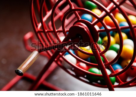 raffle game with different colored balls seen from the side