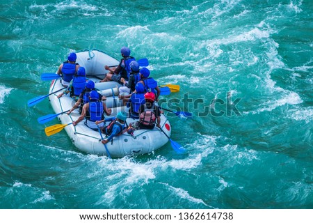 Raft in mid of River Ganges Rishikesh India.  White water  rafting water sports in Asia