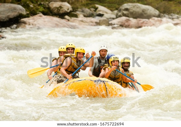raft water white teamwork ecuador fun woman rapids\
people men gathering of mixed visitor men and women with guided by\
professional pilot on whitewater waterway rafting in ecuador raft\
water white team