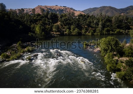 Rafters head down the Lower Fork of the American River on Saturday, May 27, 2023.