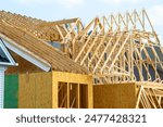 rafters of a new house frame wooden unfinished wall plywood