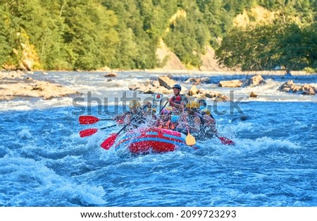 rafting by boat on a stormy mountain river