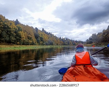Rafting on inflatable kayaks on a calm and quiet river