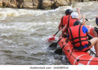 Rafting Team , Summer Extreme Water Sport.  Group Of People In A Rafting Boat, Beautiful Adrenaline Ride Down The River. Back View. POV