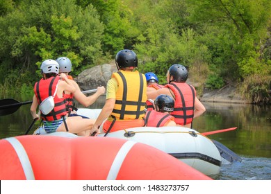 Rafting Team , Summer Extreme Water Sport.  Group Of People In A Rafting Boat, Beautiful Adrenaline Ride Down The Pacuare River,  Costa Rica. View Back.