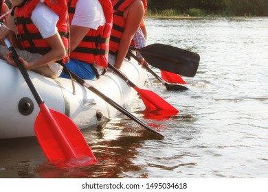 Rafting Team , Summer Extreme Water Sport.  Group Of People In A Rafting Boat, Beautiful Adrenaline Ride Down The River. Back View. POV