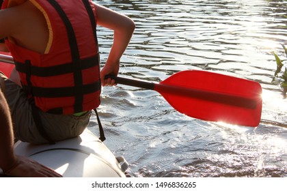 Rafting Team , Summer Extreme Water Sport.  Group Of People In A Rafting Boat, Beautiful Adrenaline Ride Down The River. Back View. POV