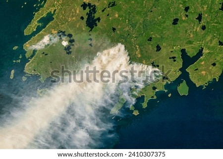 Raging Fires in Nova Scotia. Dry and windy conditions fueled the spread of unusually large fires in eastern Canada. Elements of this image furnished by NASA.