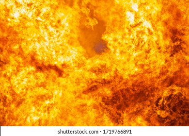 Raging flames of huge fire. Firestorm close up. Burning fire full frame image. Bright inferno flames. Hell fire explosion. Blaze fire texture. Burning bright Bonfire. Intense combustion and heat. 