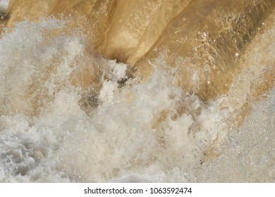 Raging Muddy Water In The River