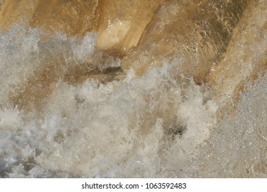 Raging Muddy Water In The River