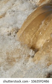 Raging Muddy Water In The River