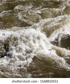 Raging Muddy Water In The River