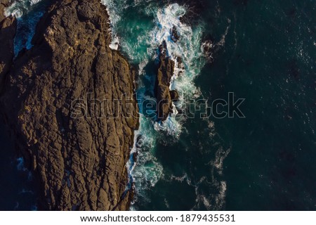 Similar – Aerial Drone View Of Dramatic Ocean Waves Crushing On Rocky Landscape