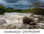 Raging Rapids of the Shire River in Malawi Under a Stormy Sky