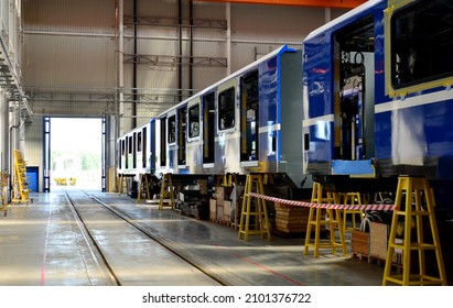 Rail Car Assembly Plant. Industrial Workshop For The Production Of High Speed Trains. Factory Of The Manufacturing Trainsets Rolling Stock. Plant For Construction And Production Of Passenger Train.