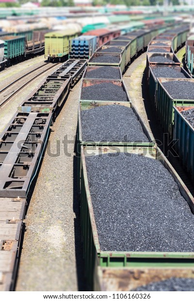 rail cars\
loaded with coal, a train transports\
coal