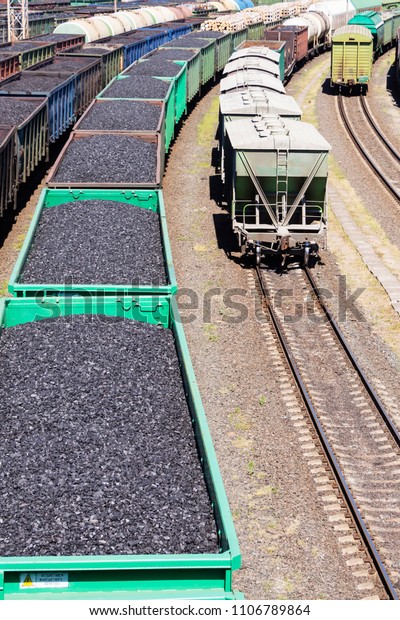 rail cars\
loaded with coal, a train transports\
coal