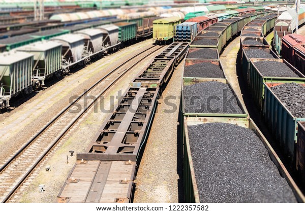 rail cars loaded with coal, a train transports\
coal. Many different rail\
cars.