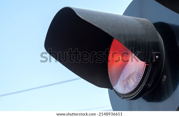 Rail crossing red warning light, train crossing
railroad station safety signal light object detail, closeup, nobody
no people. Simple rail transportation safety symbol abstract
concept, rail transport