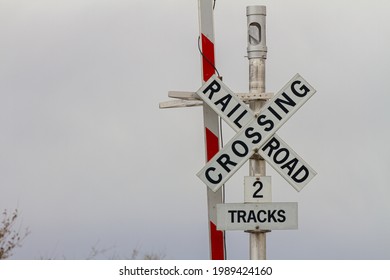 Rail Crossing Sign With The Barricade Up